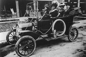 Madam C.J. Walker, the first woman to become a self-made millionaire in the United States, driving a car
