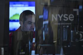 A person working at a computer terminal on the floor of the New York Stock Exchange