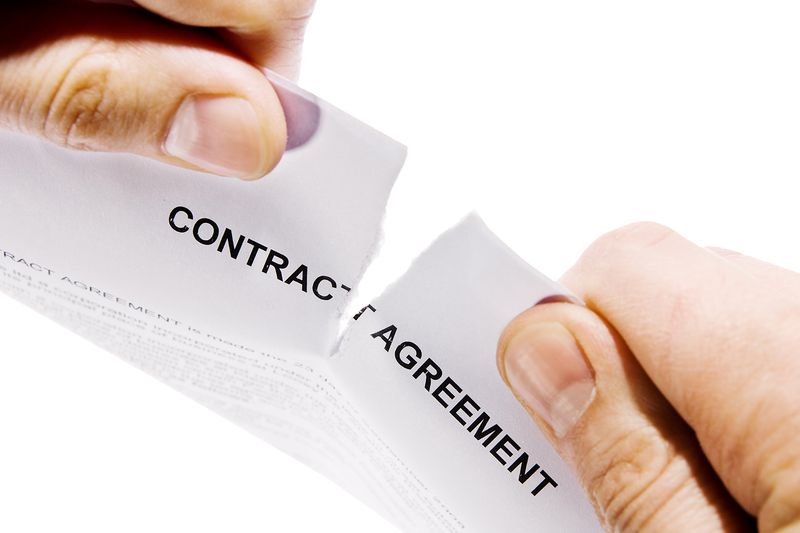 Hands Ripping Contract Agreement Document