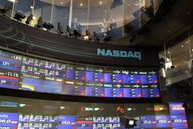 Shot of a board in the NASDAQ displaying tickers