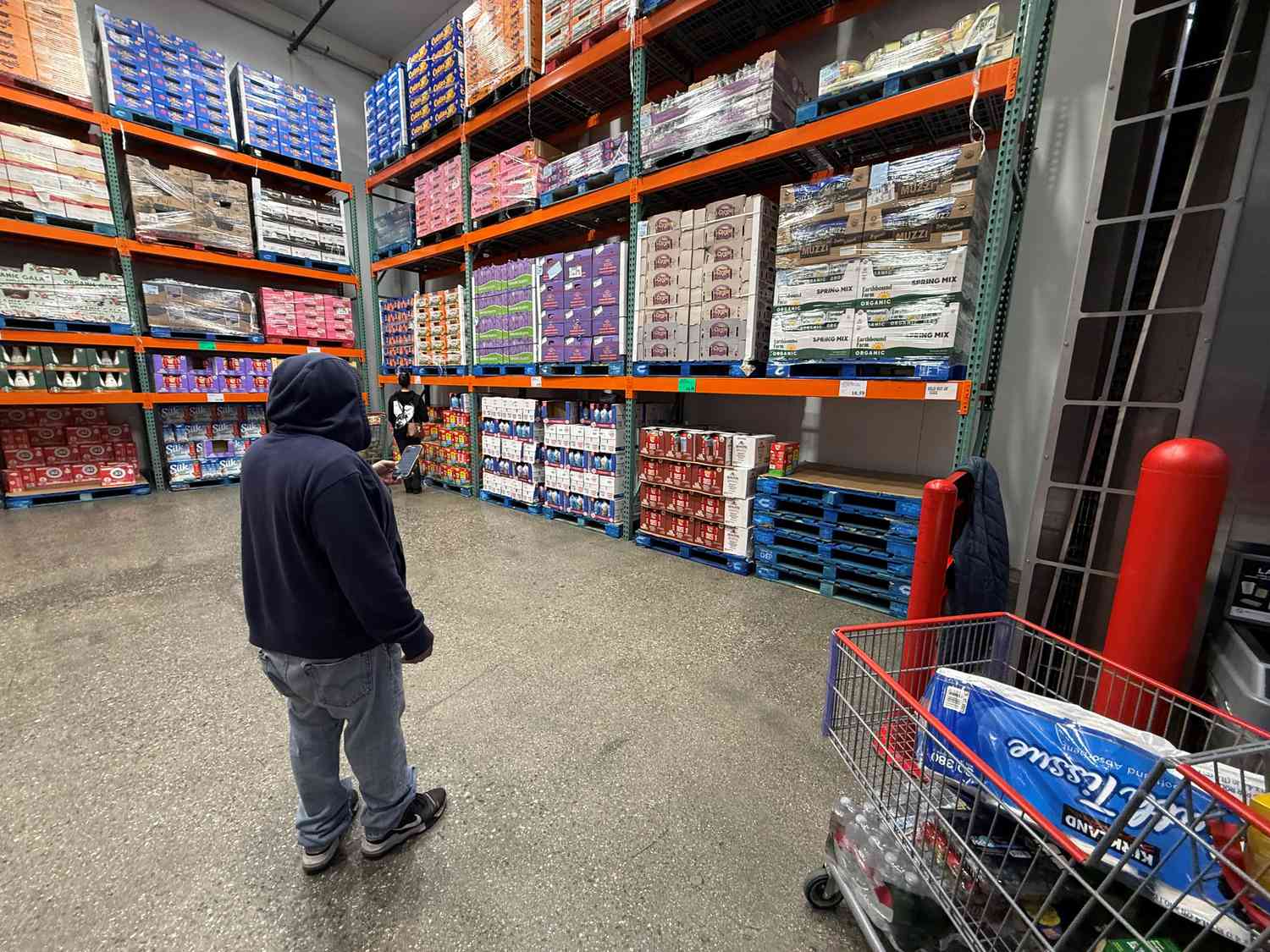 A customer shopping for eggs at a Costco store in Azusa, Los Angeles County, California