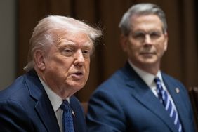President Donald Trump and Treasury Secretary Scott Bessent sit in a meeting room