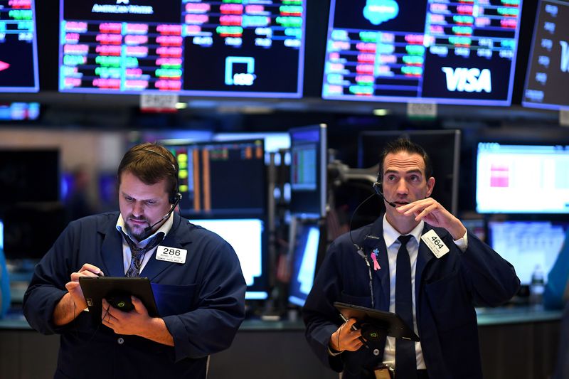 Traders on the floor of a stock exchange at the opening bell.