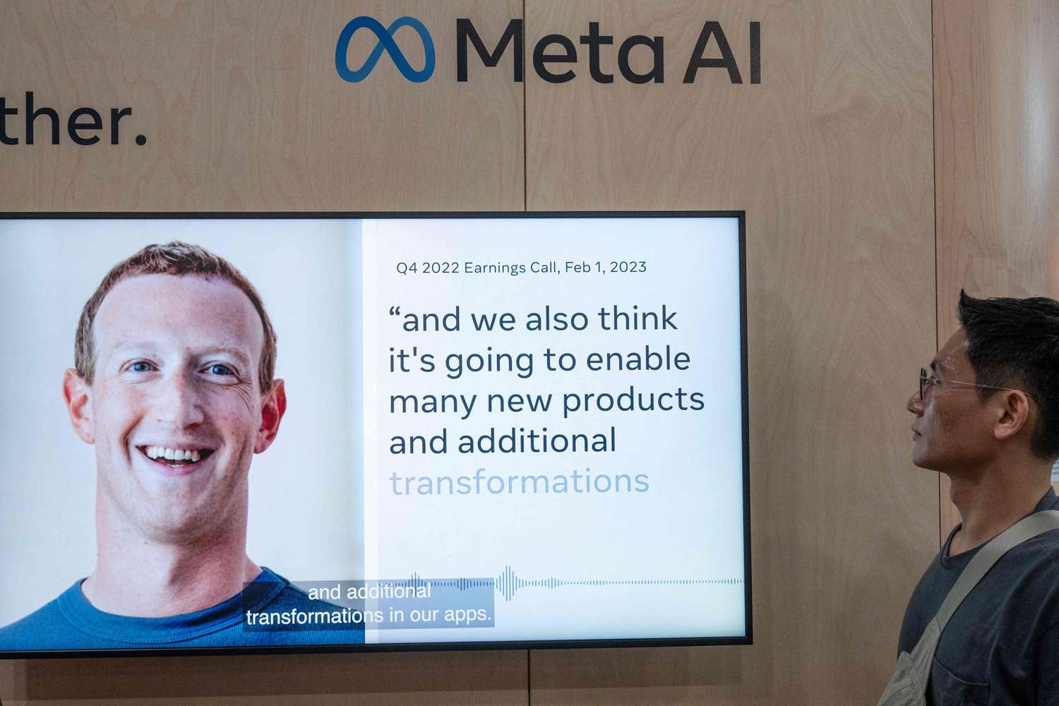 A screen displays a quote from Meta CEO Mark Zuckerberg at an event.