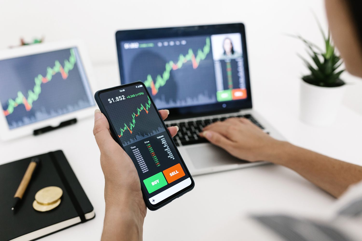 Woman using stock market cryptocurrencies mobile and website app