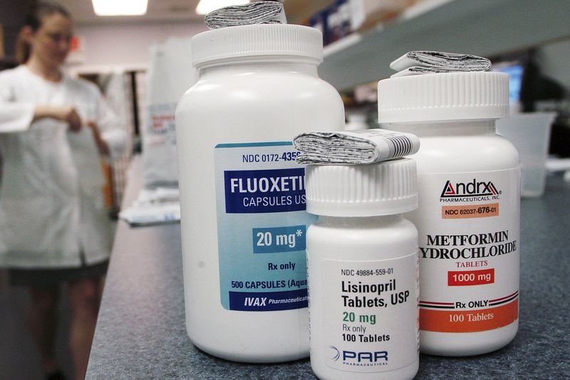 Prescription drugs on a pharmacy counter.