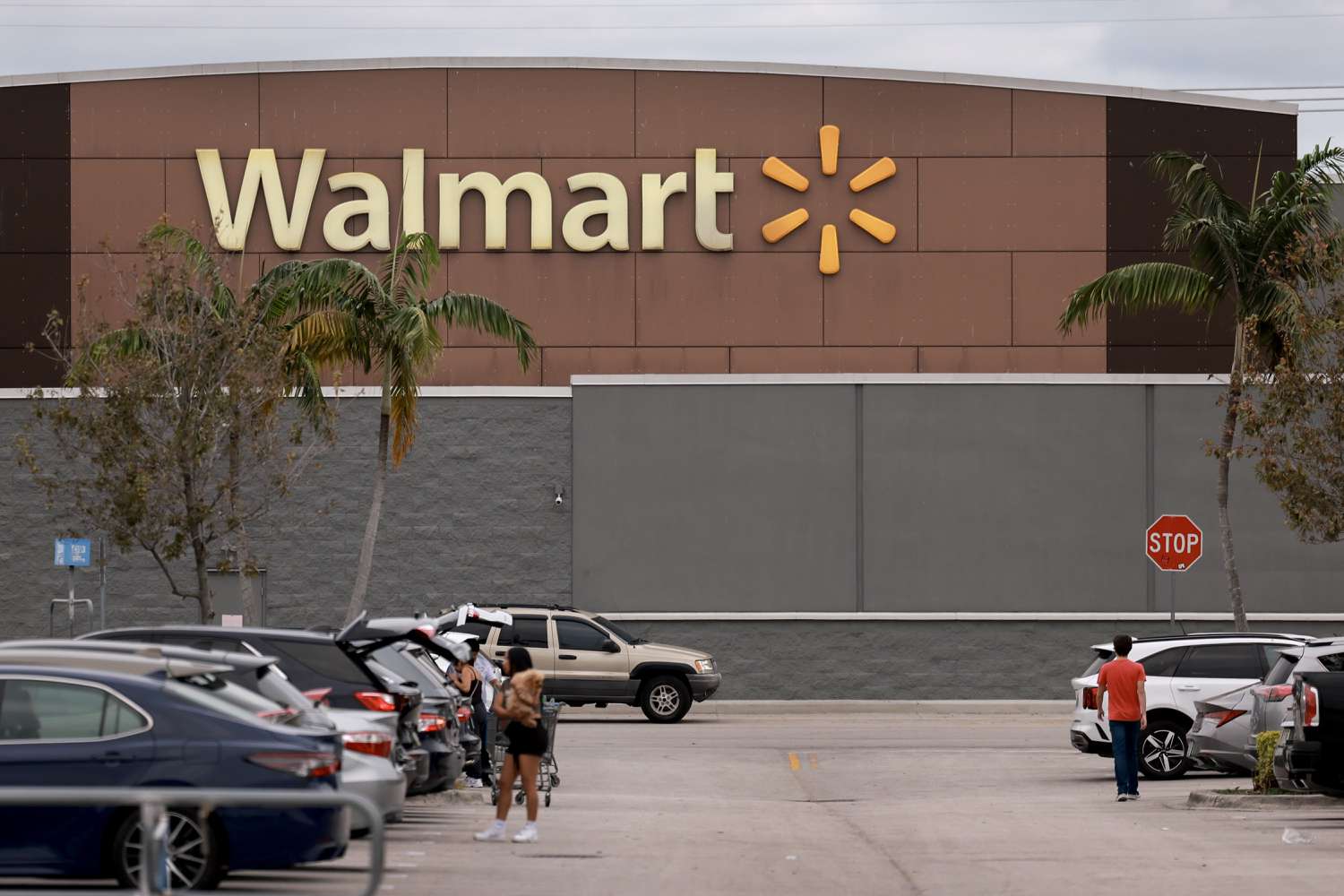 A Walmart sign is displayed outside a Supercenter on November 18, 2024 in Miami, Florida