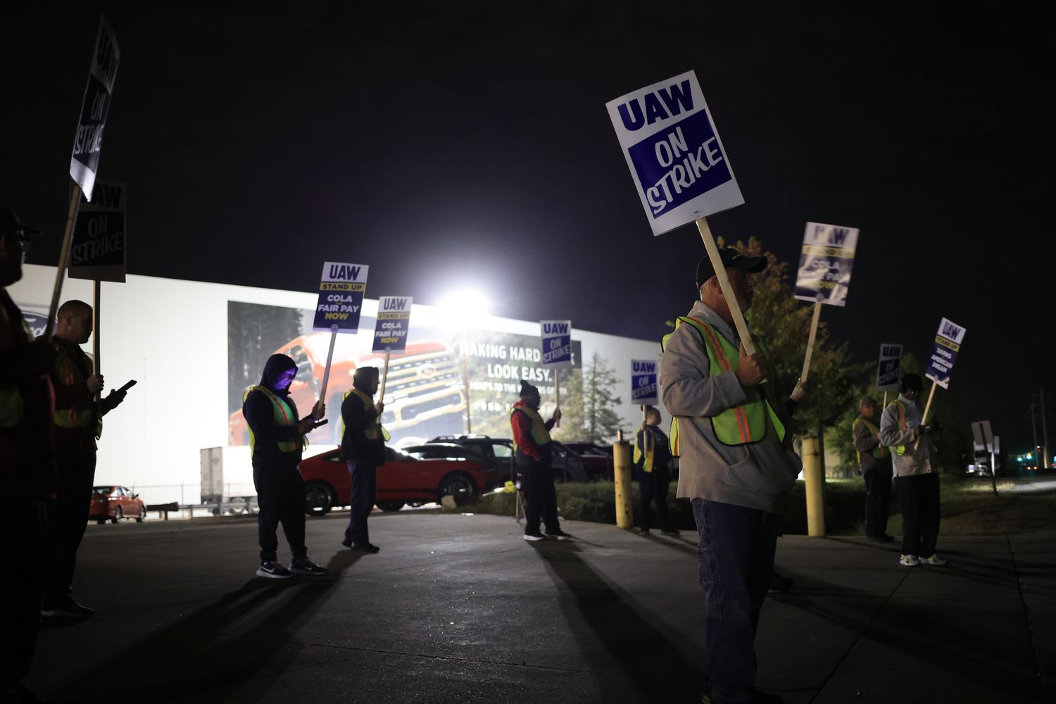 Factory workers and UAW union members form a picket line outside the Ford Motor Co. Kentucky Truck Plant 