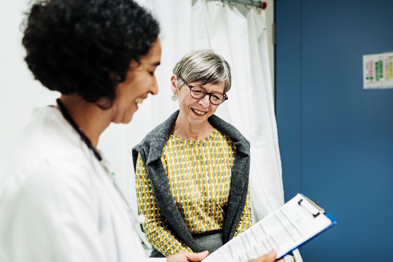 Doctor Going Over Test Results With Patient