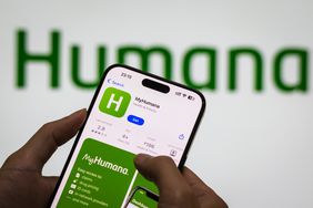 MyHumana Apple Store page on a smartphone in front of the Humana logo.