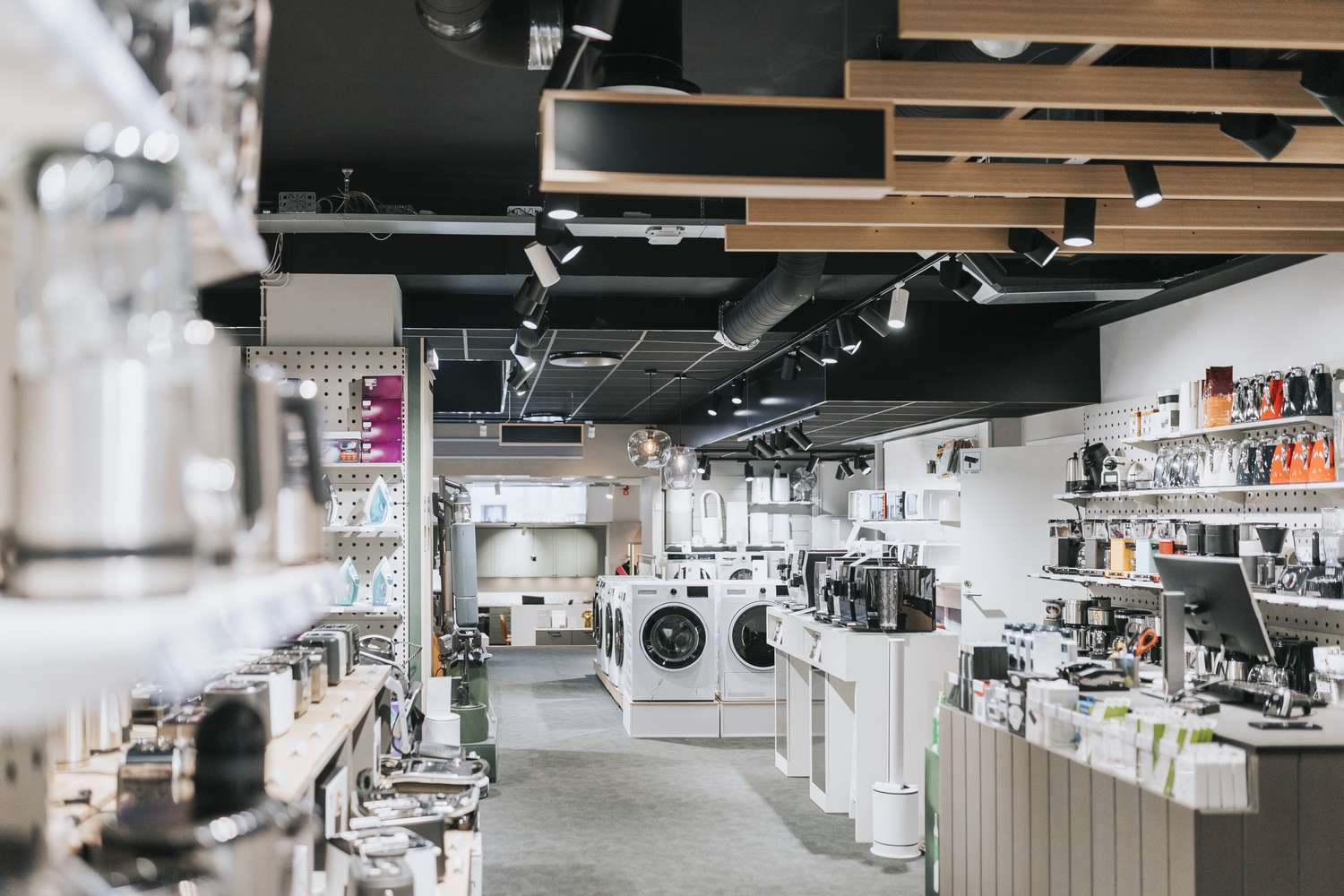 Interior of electronics store with various appliances arranged for sale - stock photo