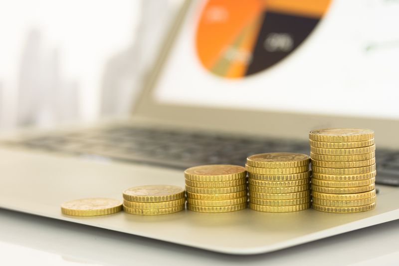 coins on laptop