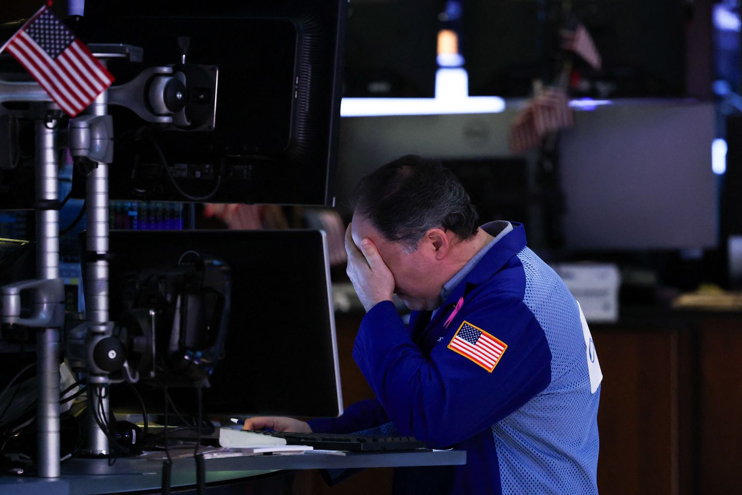 A trader works on the floor of the New York Stock Exchange.