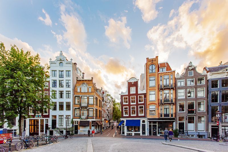 Amsterdam skyline with traditional Dutch houses during sunset, Holland, Netherlands