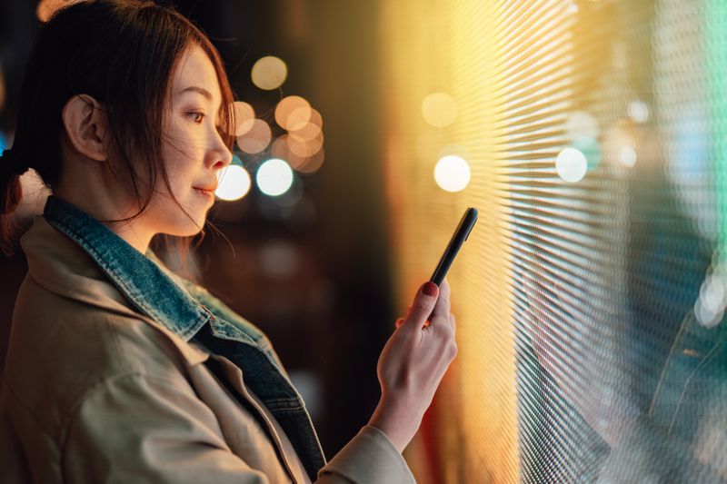 Woman looking at smart phone