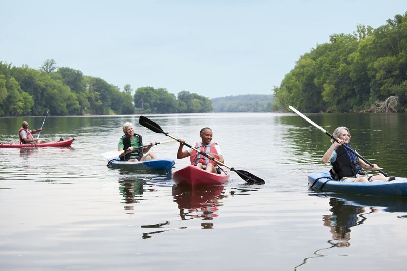 Couples kayaking on a river in Virginia