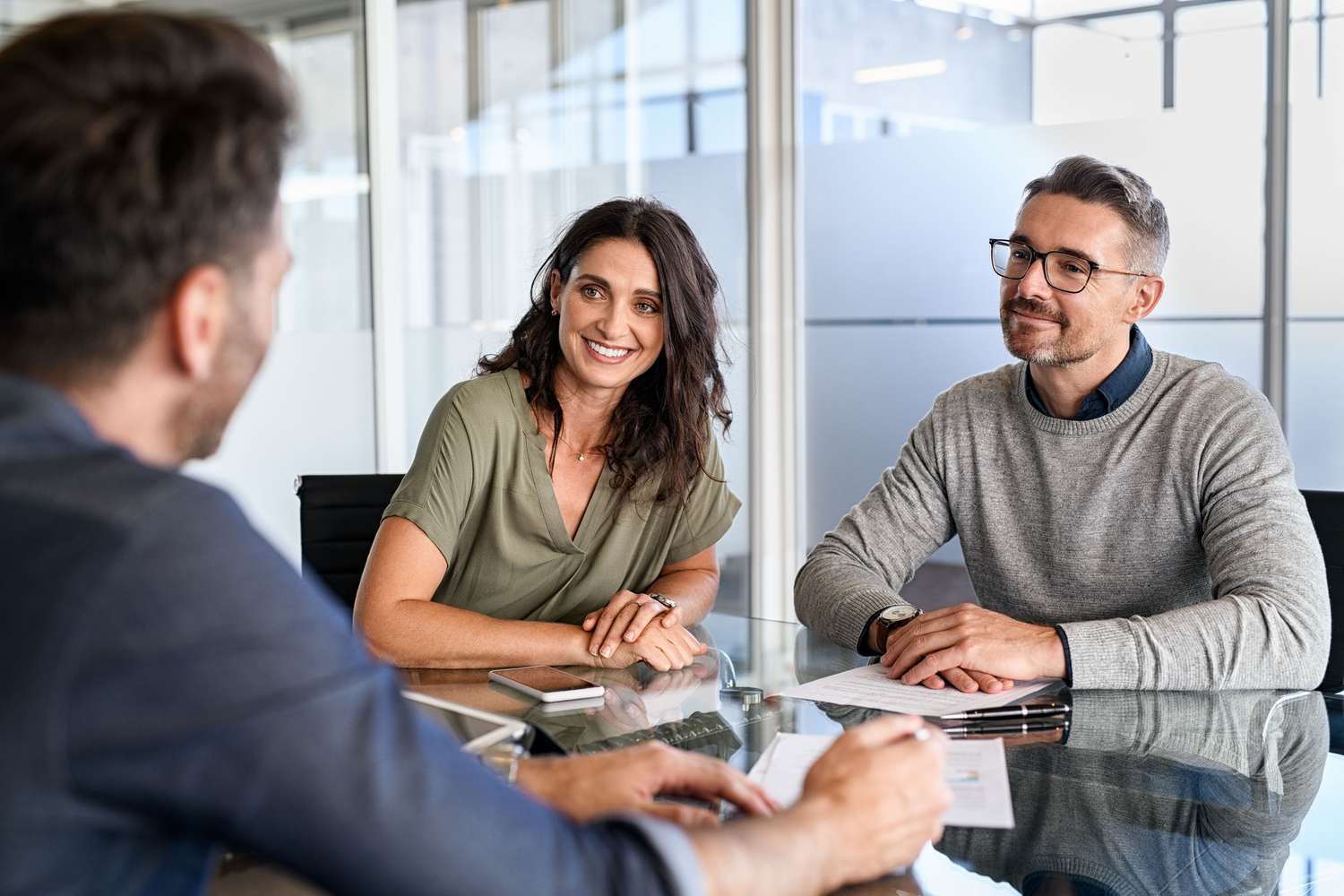Mature couple meeting financial advisor about CD Rates