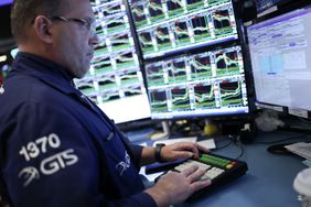 Traders works on the floor of the New York Stock Exchange 