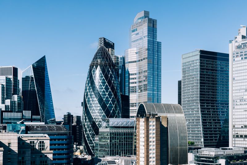 Picture of buildings in the City of London's financial district including the Gherkin building.