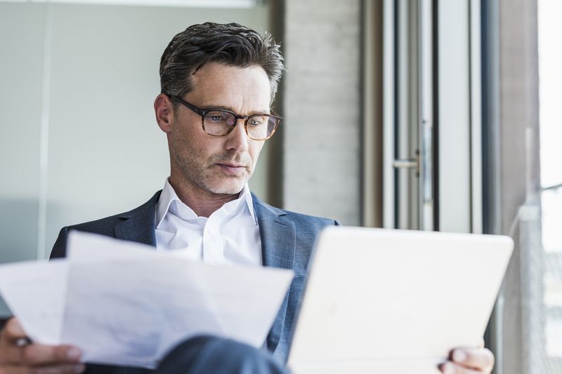 Man reviewing papers.
