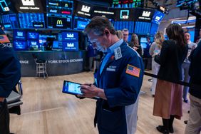 Traders work on the New York Stock Exchange (NYSE) floor