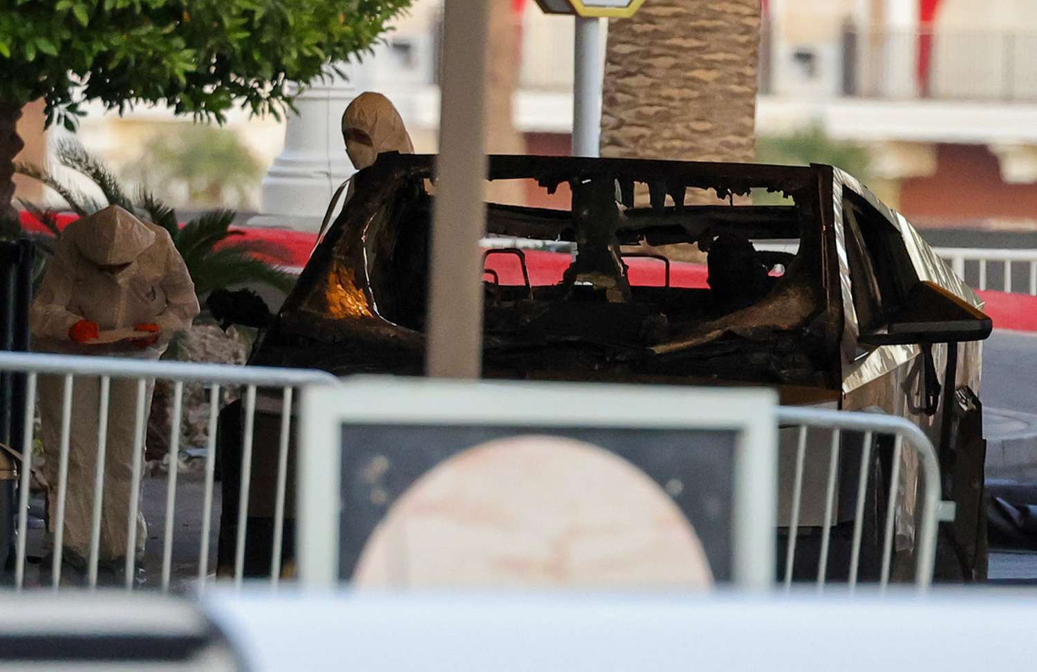 First responders wearing Hazmat gear investigate a Tesla Cybertruck that exploded in front of the entrance to the Trump International Hotel & Tower Las Vegas on January 01, 2025 in Las Vegas, Nevada