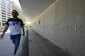 Man walking on the street beside the World Bank