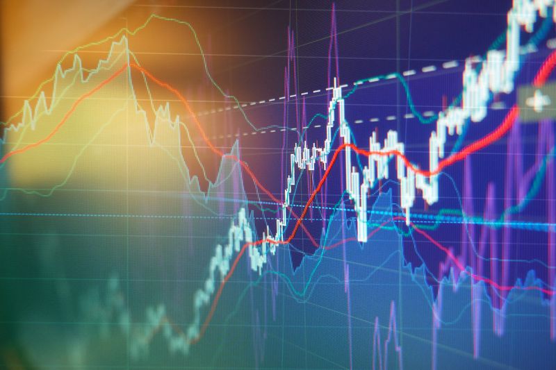 Graph charts of stock market investment trading.
