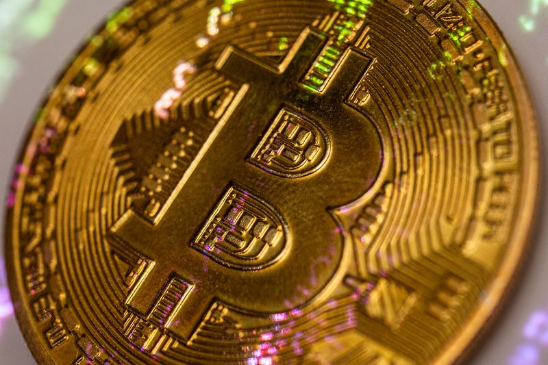 A yellow coin with the B symbol for Bitcoin.