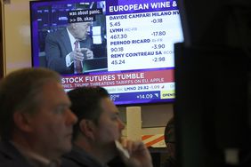 Traders work on the floor of the New York Stock Exchange (NYSE) at the opening bell on May 23, 2025, in New York City. 