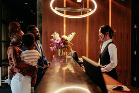 Family checks into a hotel