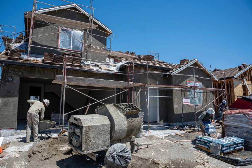 Construction workers at a new housing community in Folsom, California, US, on Wednesday, July 3, 2024.