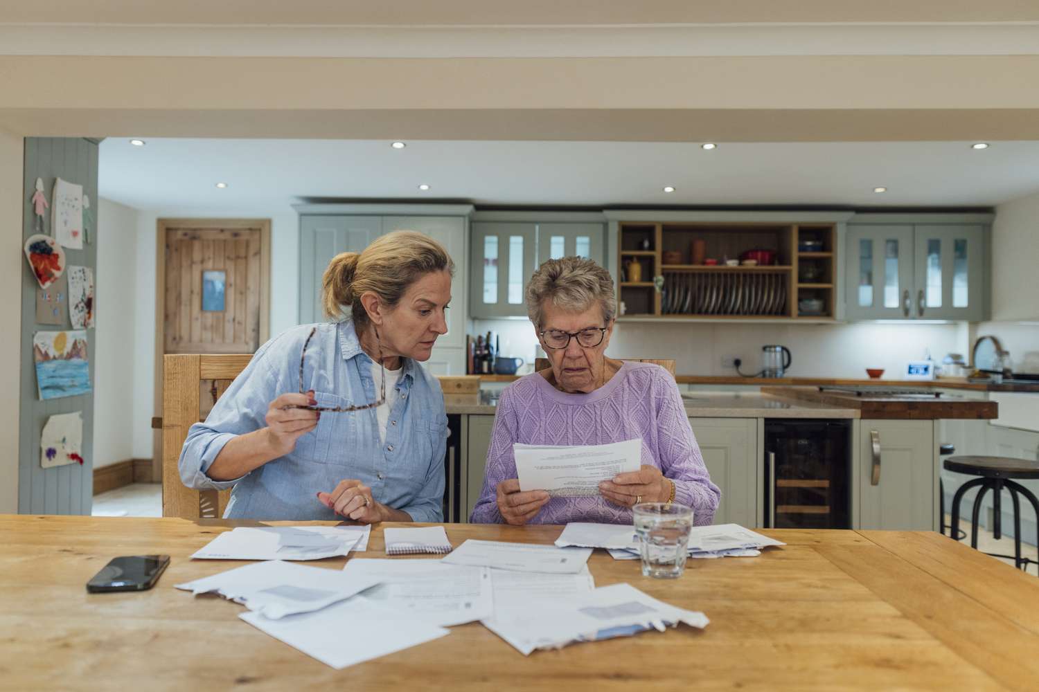 Woman going over the details of a Rural Housing Service (RHS) loan with her mother