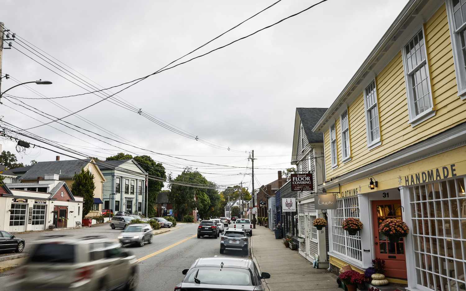 A view down Main Street, home to AnnTiques, shows historic buildings and local businesses. 