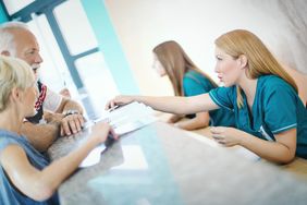 Senior Couple Make Doctor’s Appointment