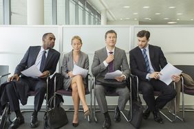 Business People Sitting in Waiting Area
