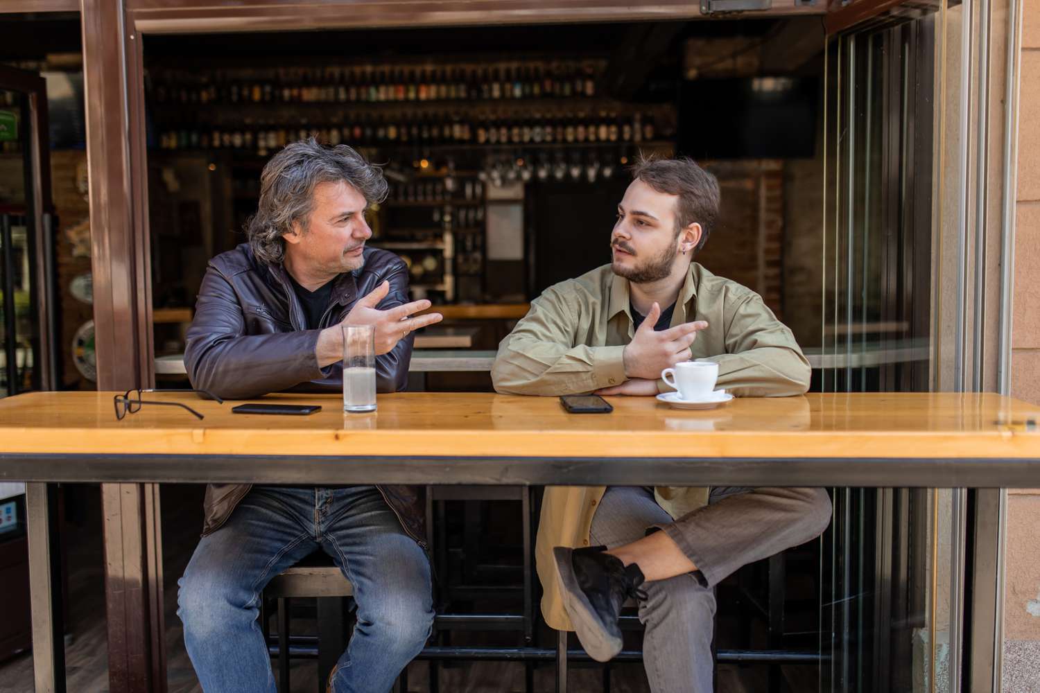 Two friends having coffee