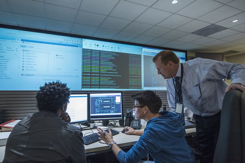Colleagues Working Together in Server Control Room