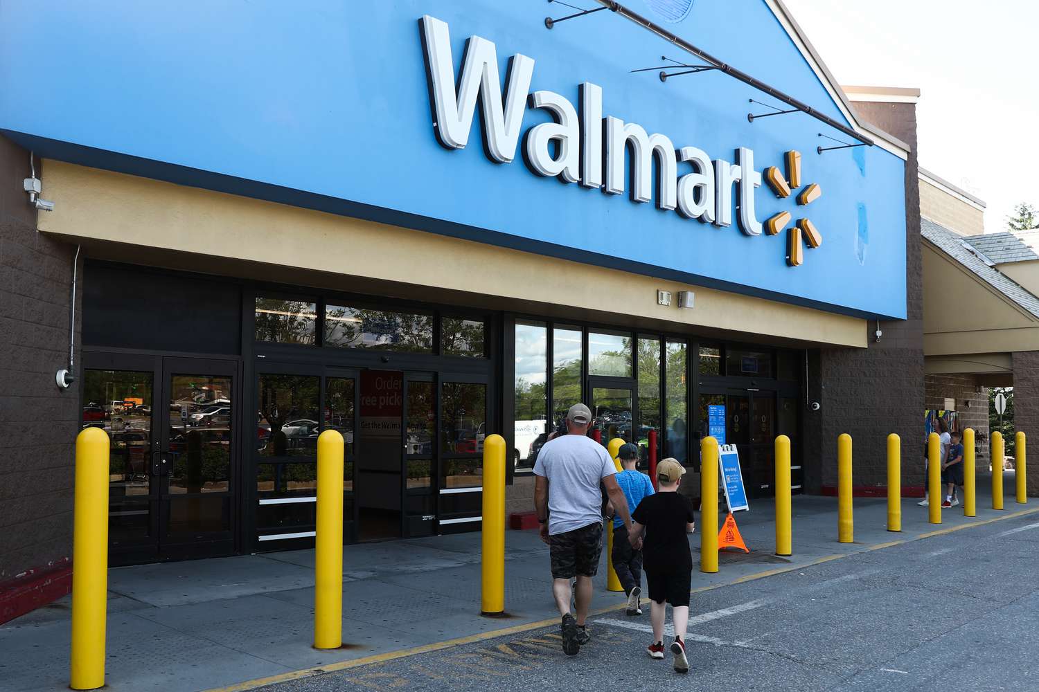 Customers walking into a Walmart