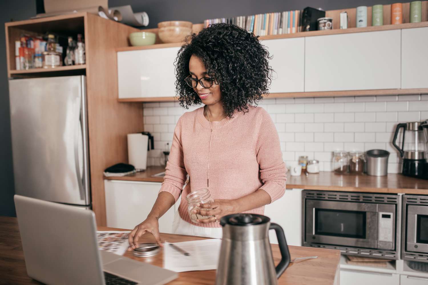 Woman looks over loan documents and considers getting a co-signer for the loan.