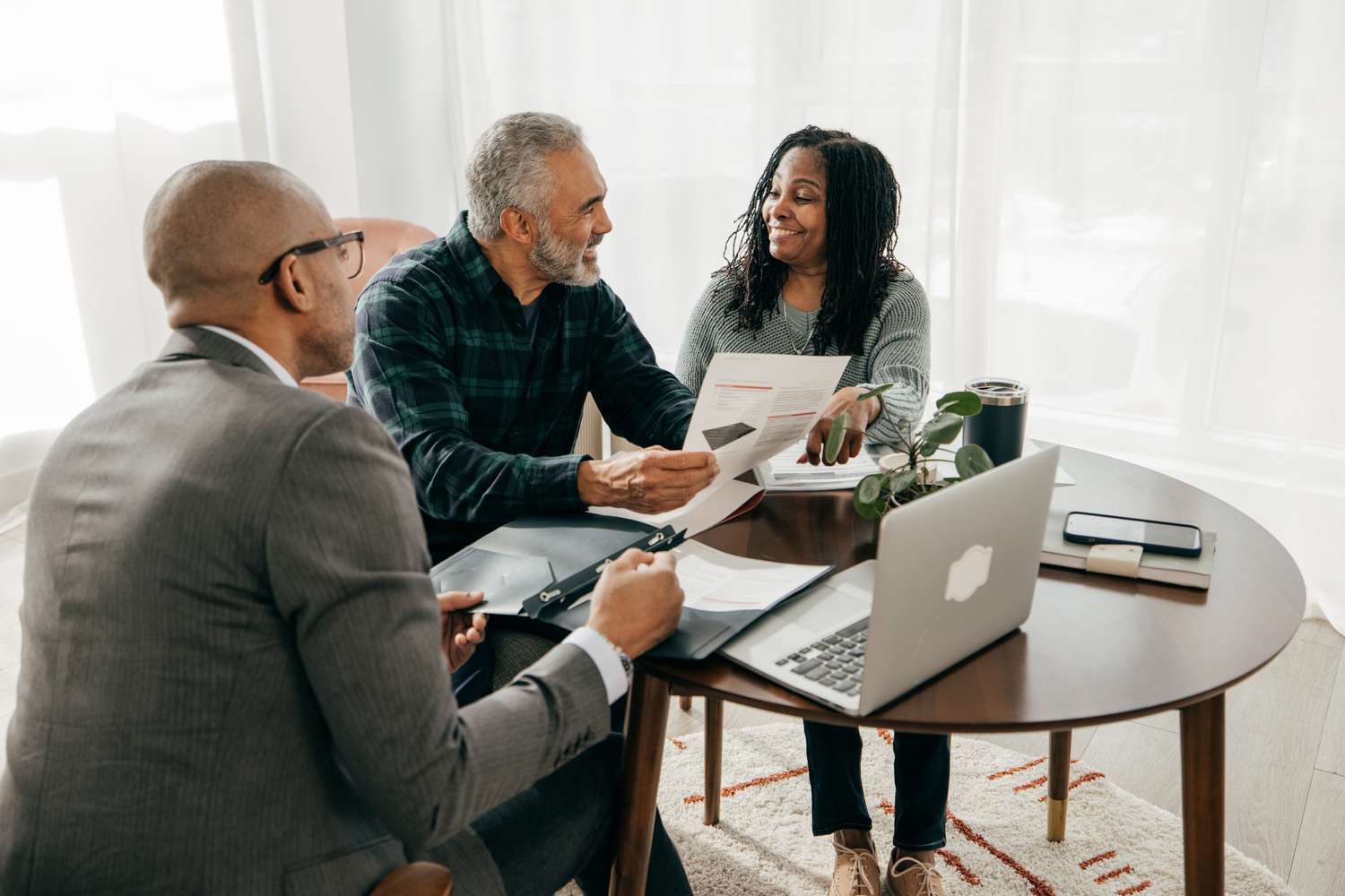 Mortgage broker meeting with couple
