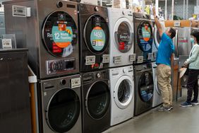 Shoppers browse washer and dryer appliances displayed for sale inside a Home Depot store in Colma, California, US, on Friday, May 30, 2025.