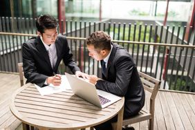 Colleagues Working Together at the Desk