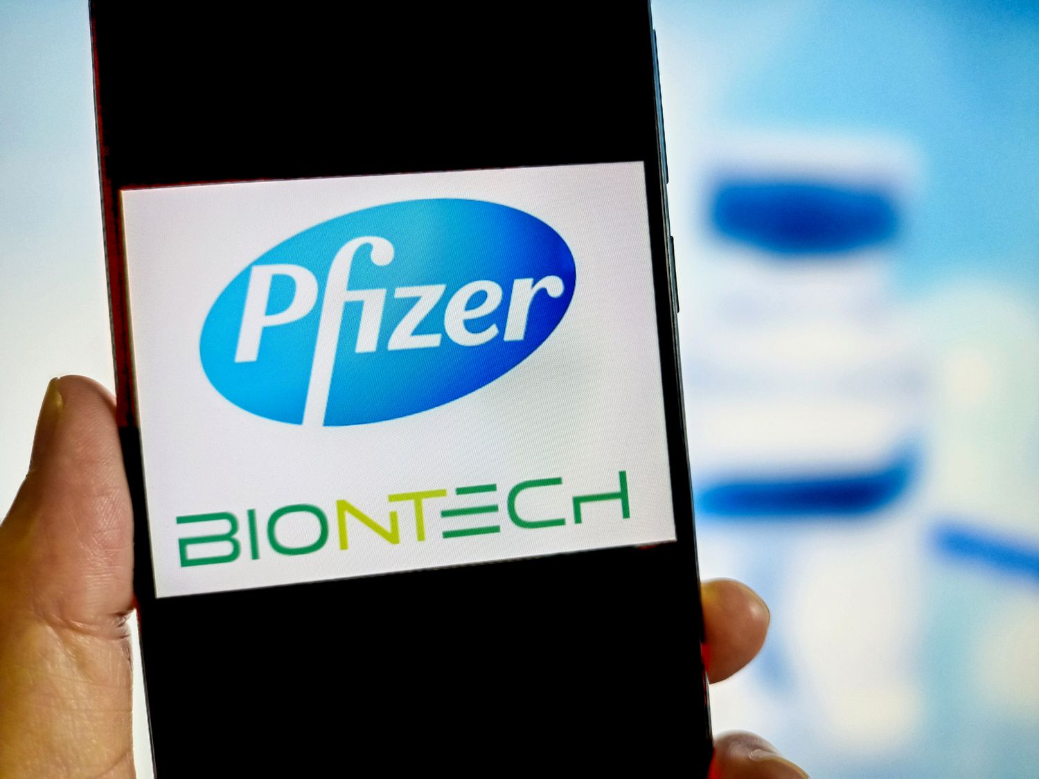 Pfizer and BioNTech logos on a smartphone 