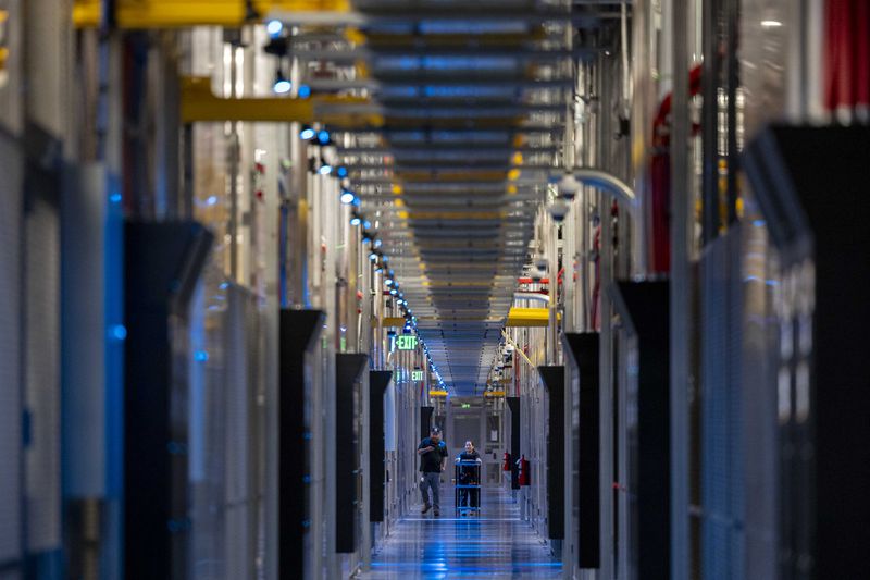 People walk through the hallways at Equinix Data Center in Ashburn, Virginia