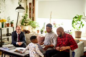 Parents with son discussing finances with advisor