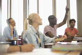 Student raises hand in class