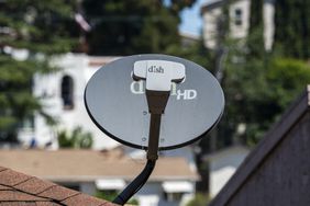 A Dish Network satellite dish on the roof of a home