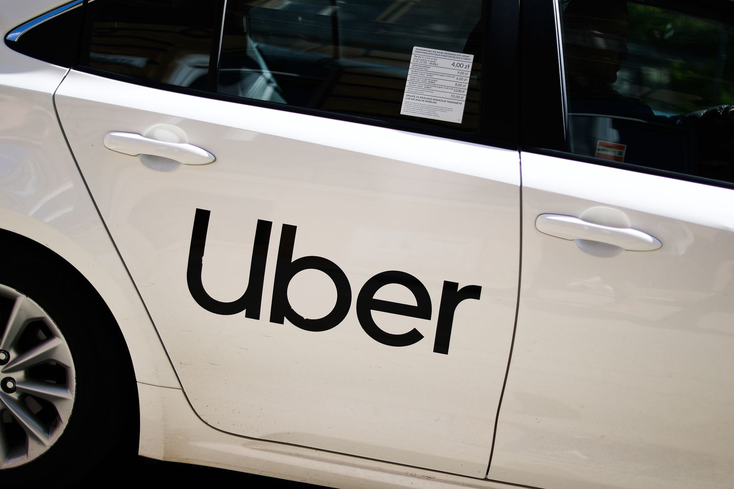 Uber logo is seen on a car in Krakow, Poland on May 9, 2023