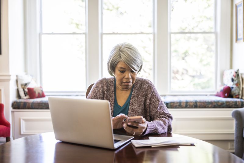 Woman researching whether credit repair companies really work